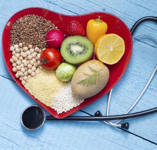 A heart shaped bowl of food with a stethoscope.